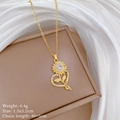 Detailed view of a gold sunflower heart pendant necklace with shimmering crystal stones - Titanium Steel / Copper / Sunflower Heart Necklace (D247)