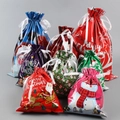 Detailed view of assorted Christmas gift bags with colorful festive patterns and ribbons - Set 9 (24-Piece)