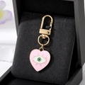 Pink heart-shaped evil eye keychain with gold-plated lobster clasp on velvet pad - Pink Heart Eyelash Eye