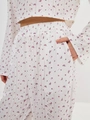 Detail of pink floral eyelet fabric with Teneri print and side pocket on pajama pants - S / Pink Floral