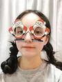 Christmas party glasses with Santa Claus design worn by person for festive events - Standing Santa Claus