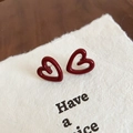 Minimalist deep red hollow heart stud earrings with a glossy enamel finish and silver pins - Hollow Heart Style / Red