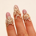 Three-piece set of golden nail rings with sparkling white rhinestones on model fingers - Radial Zirconia Fingertip Ring 3pcs Set (H03)