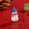 Detail of resin snowman pendant with dimensions 1.25x0.62in and weight 2.8g - Blue Hat Red Scarf Glitter Snowman