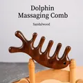 Green sandalwood hair massage comb in dolphin shape with natural wooden texture - Golden Silk Sandalwood - Dolphin Shape