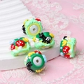 Detailed view of hand-painted acrylic beads with ant and mushroom patterns for DIY crafts - Mushroom and Ant