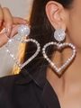 Close-up of sparkling heart-shaped rhinestone earrings with high-shine crystal accents - Silver Hollow Big Heart