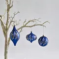 Detailed view of blue PVC Christmas ornaments with silver glitter waves on branch - Blue Special-shaped 3-piece Set (3pcs/15cm)