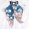 Elegant silk scarf with white magnolia floral print and sophisticated navy blue satin finish - Haze Blue