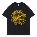 Alligator Alcatraz graphic black cotton T-shirt with yellow circular chest print - S / Black