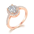 Detail of rose gold engagement ring with oval diamond and micro-pave halo setting - Egg-shaped Rose Gold White Stone