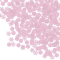 Nahaufnahme von rosa Schneeflocken und runden Konfetti-Teilen auf weißem Hintergrund - Rosa Schneeflocke + Rosa Rund