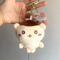 Brown and white plush doll keychain in soft polyester being held against grey background - 12cm / Brown Head Monster Style