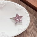 Detailed close-up of a pink rhinestone star hair clip with colorful crystal accents - Full Zirconia Pentagram / Pink