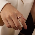 Minimalist vintage gold ring featuring oval purple zircons worn on index finger - Style B Purple