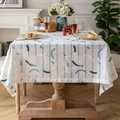 French linen tablecloth with blue brushstroke patterns on a white background - Aurora Blue