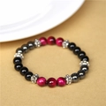 Natural tiger eye bracelet with black, red and silver beads on brown paper background - 19cm/8mm Bead Diameter / Rose Red Tiger Eye
