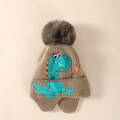 Brown kids knit earflap hat with green dinosaur motif and plush pompom decoration - Knitted Dinosaur / Coffee