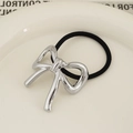 Minimalist silver bow metal hair tie with high-elastic black rubber band for ponytails - Bowknot Style Silver