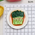 Detailed view of 6cm asparagus miniature resin magnet model on measuring mat - Cantonese Choy Sum