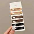 Set of 6 rectangle matte hair clips in earth tones on white card held by hand - 9# Classic Tri-Color Hair Clips - 6Pcs