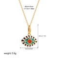 Detail showing 18K gold evil eye pendant dimensions 29x23mm and colorful enamel accents - Green Enamel Red Zirconia