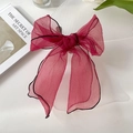 Elegant fuchsia organza bow hair tie with black contrast piping for a stylish look - Red