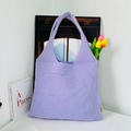 Detailed close-up of purple knit tote bag showing intricate hollow crochet texture - Purple