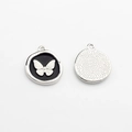 Detail view of butterfly charm pendants with black enamel and silver textured backing - Black-Silver