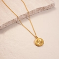 Detailed macro view of 18K gold plated sun coin pendant with embossed religious figure - Necklace - Gold Sun (Real Gold Plated)