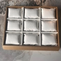 Top view of 9-grid wooden watch tray with white velvet pillows on marble background - 9 Slots / 9-Slot Gold Rim with White Pillow (Bronze/Gold)