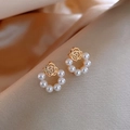 Detail of rose pearl earrings featuring gold hollow floral design and white pearls - 28# Pearl Flower Studs