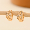 Elegant champagne gold leaf hoop earrings with cubic zirconia on a wooden branch - EH210 Golden Leaf Shape