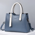 Elegante borsa a mano in pelle a contrasto blu e bianco con manico e tracolla alla moda - Blu