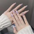 Macro detail of long coffin-shaped iridescent press-on nails with mermaid pearl finish - By1733 Fairy Jade Color / Phototherapy Glue Style