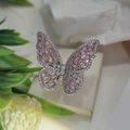 Macro shot of silver butterfly ring featuring pink and white marquise-cut zircons - Silver Color Pink Zirconia