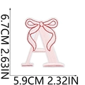 Detailed view of pink embroidered letter A patch with bow accent and white border - Pink Letter A