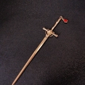 Detailed close-up of a golden sword-shaped hair pin with a red teardrop gemstone charm - Sword Teardrop-Gold