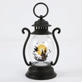 Detail of Halloween witch lantern with spooky castle pattern and LED interior lighting - Witch