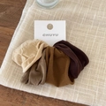 Set of beige and brown seamless elastic hair ties on display card with soft nylon texture - Mocha Coffee Series 4-Pack
