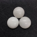 Three white natural agate round cabochons for DIY jewelry making on black background - White Jade