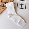 Minimalist white ribbed cotton crew socks for women featuring a rolled cuff design - One Size / White