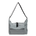 Close-up of light blue nylon tote bag with black woven zipper cords and adjustable strap - Blue