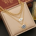 Three-layer gold necklace with evil eye and sun pendants on beige leather jewelry box - 1# Three-Layer Evil Eye Necklace / Gold