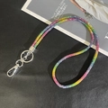 Detailed macro of rainbow rhinestone phone strap with silver lobster clasp and metal ring - 6mm Rhinestone Pendant / Multicolor (K3144)