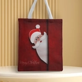 Close-up of Santa Claus print and Merry Christmas text on a red canvas tote bag - Style 19