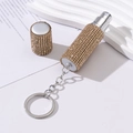 Close-up of gold rhinestone-studded perfume bottle with metal keychain on marble - 5ml / Gold