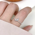Minimalist s925 silver croissant ring with twisted band shown on a hand - Croissant