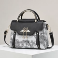 Fashionable contrast paisley print handbag with golden swan clasp on a display stand - Paisley Pattern/Metal Swan Buckle / Flower Black