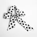 Satin silk scarf featuring a black and white polka dot design tied in a bow - S51-White Base Large Black Polka Dot